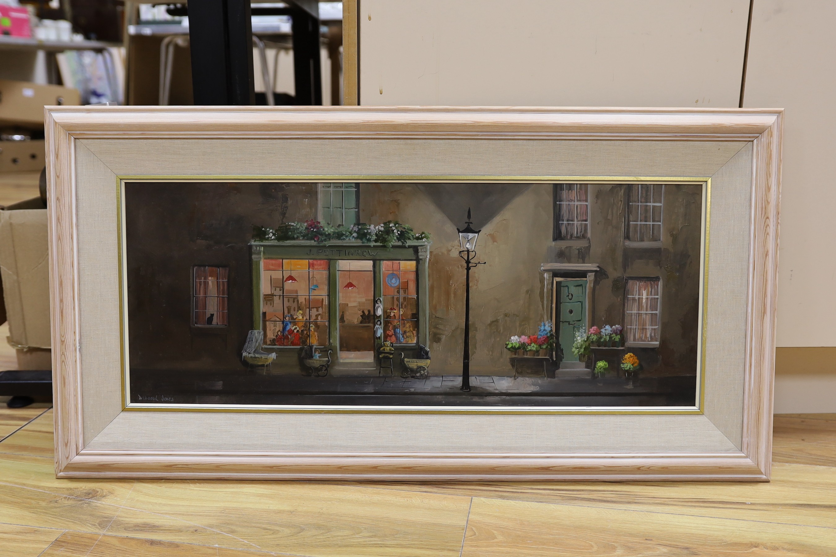 Deborah Jones (1921-2012), oil on panel, 'J Pettigrew's Toy Shop', signed, 29 x 75cm